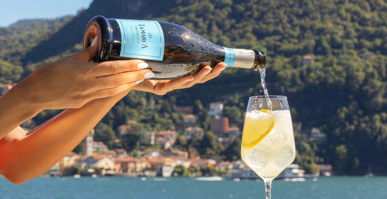 A bottle of La Marca Prosecco DOC featuring its iconic 'La Marca Blue' label with silver accents and a matching silver foil-wrapped top.